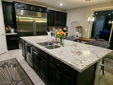 Kitchen featuring a sink, stainless steel applianc