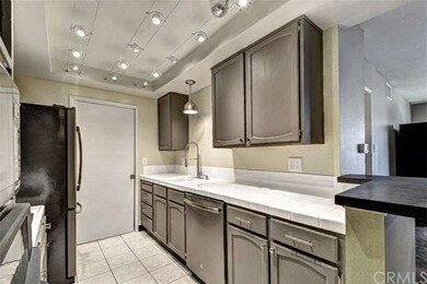 Newer faucet and refaced cabinets provide a stunni