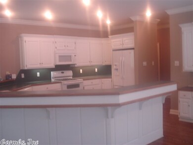 Open to sunroom and breakfast area