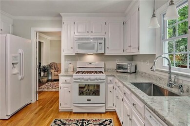 The kitchen features a large undermount stainless 