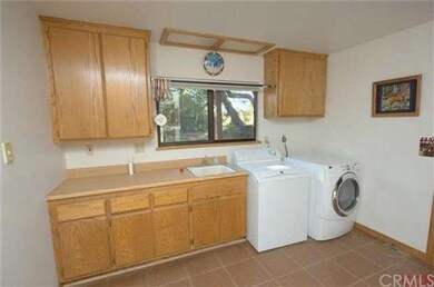 Spacious laundry room with plenty of storage in th