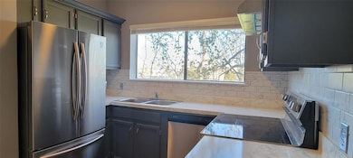 Kitchen featuring appliances with stainless steel 