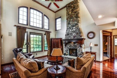 Two-story family room features a floor-to-ceiling 