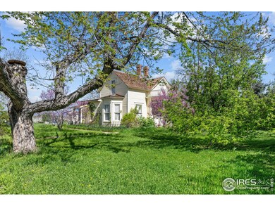 Old growth deciduous trees surround this home.