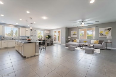 Living room virtually staged featuring recessed li