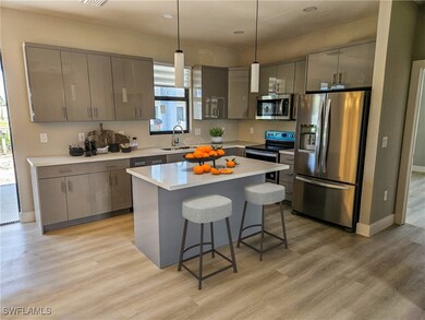 Kitchen featuring a center island, light wood-type