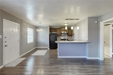 Kitchen featuring dark wood-type flooring, kitchen