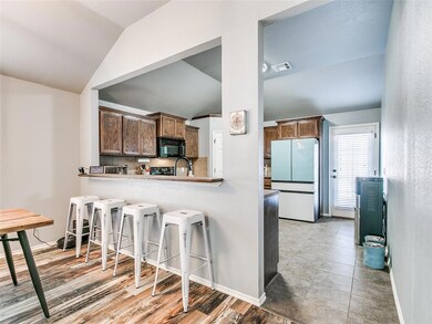 Eat up bar overlooking the kitchen.