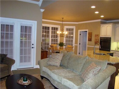Sitting area with Exterior Exit door from kitchen, Eat-in Dining area, tile floors throughout.