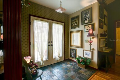 Double Door Entrance with Slate Flooring in Foyer