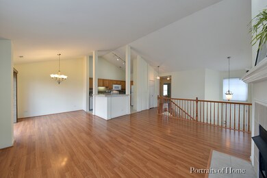 Wood laminate flooring in both living room and din