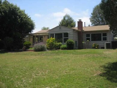 Large parklike backyard.