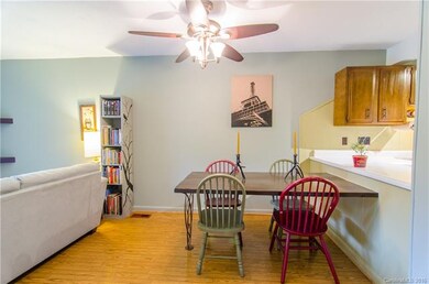 Well-lit dining space flows into both the kitchen 