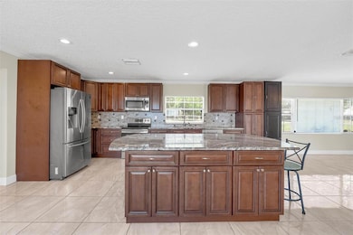 Sleek, Open & Modern Chef’s Kitchen with premium finishes, ample counter space, and seamless flow—perfect for entertaining or everyday luxury.