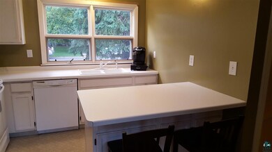 Kitchen with Breakfast Bar and 5 year old applianc