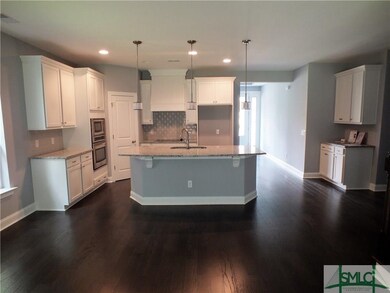 Gourmet Kitchen w/ White Cabinets & Grey Back-Spla