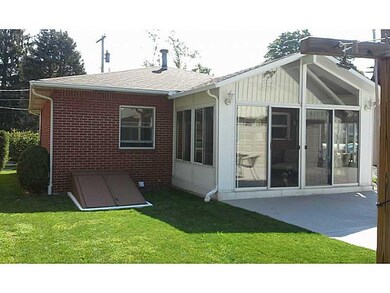 Exterior Back. Great 4 season room and level yard,