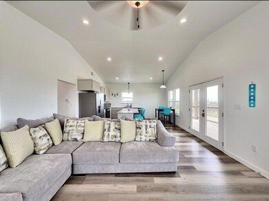 Living area with recessed lighting, french doors,
