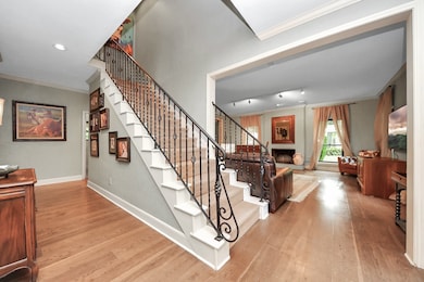 This generous entryway offers a warm welcome with