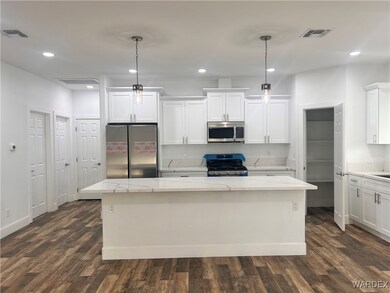 Kitchen featuring appliances with stainless steel