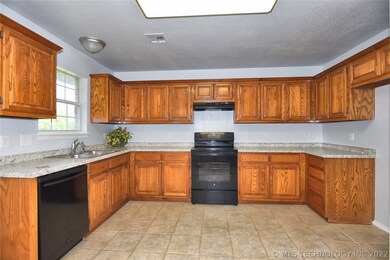Large kitchen w/ new stove and plenty of storage.