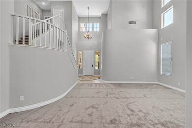 View of entry and stair case from dining room.