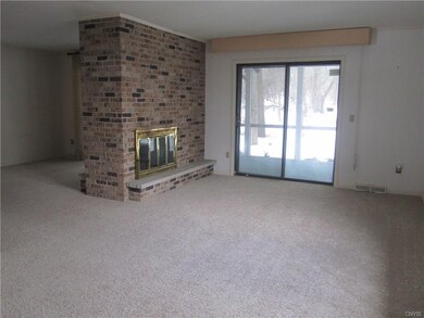 LIVING ROOM WITH 2 SIDED GAS FIREPLACE WITH SLIDER