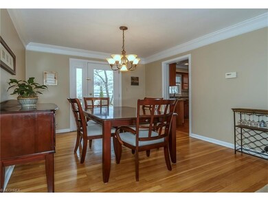 Dining Room with hard wood floor and double crown 