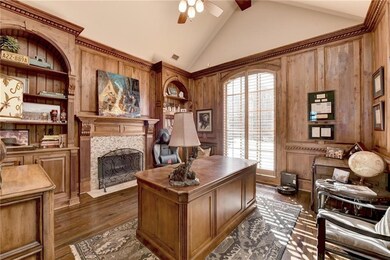 Main level gentleman's office with panelling and f