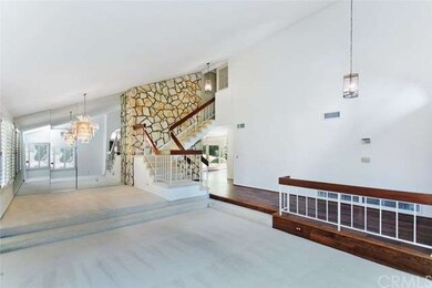 Cathedral ceilings add visual drama to formal livi