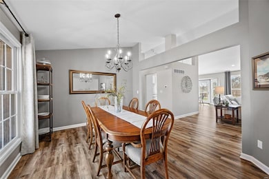 Spacious sun lit dining room.