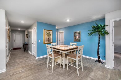Dining area with hardwood / wood-style floors