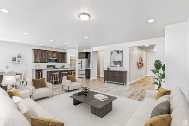 Living room with light wood-style floors and recessed lighting
