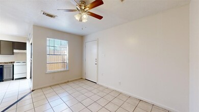 Empty room with light tile patterned flooring and