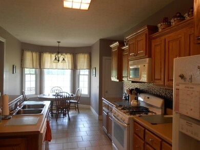 The Kitchen has an Eat In Nook and a walk in Pantry Closet.  You will enjoy the view of country life from the bay window overlooking the back of the property!