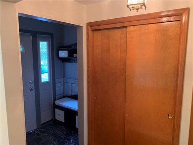 ENTRANCE WITH BENCH AND GUEST COAT CLOSET