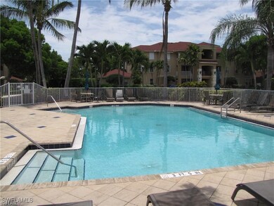 Community pool featuring fence and a patio