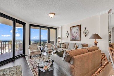 Living room featuring a textured ceiling, floor to