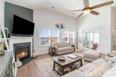 Living room featuring a fireplace with flush heart