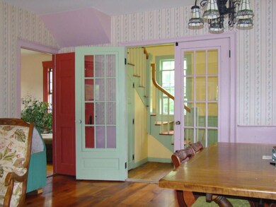 Lovely staircase and foyer leading...