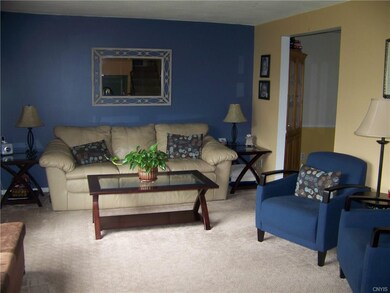 Spacious living room with new carpet & freshly pai