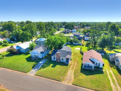 A clear view of the peaceful Midtown streetscape shows how conveniently located this home is, close to Independence Street, Kickapoo Avenue, and the revitalizing Wildwood Park.