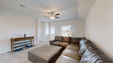 Living room with ceiling fan, light tile patterned