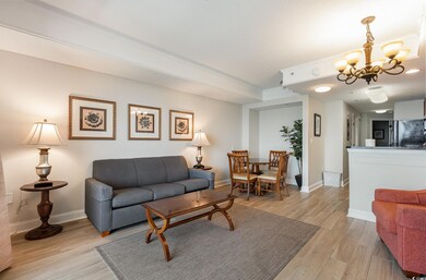 Living room with light hardwood / wood-style floor
