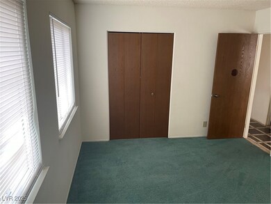 Unfurnished bedroom featuring a closet and carpet