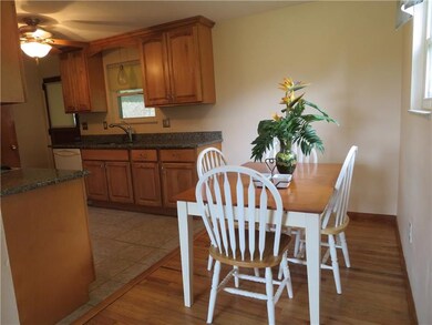 Eat in kitchen with gleaming hardwood flooring