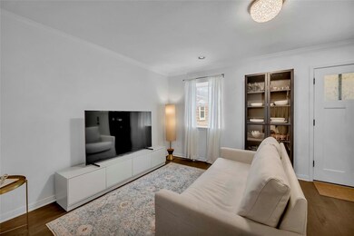Living room featuring dark wood finished floors, 