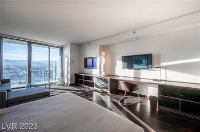 Bedroom with floor to ceiling windows, built in st