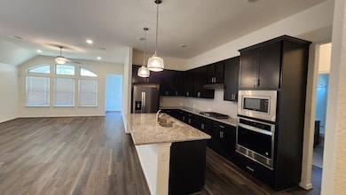 Kitchen featuring appliances with stainless steel