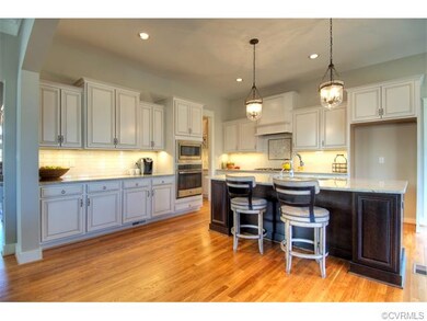 The spacious kitchen is warm and welcoming with so